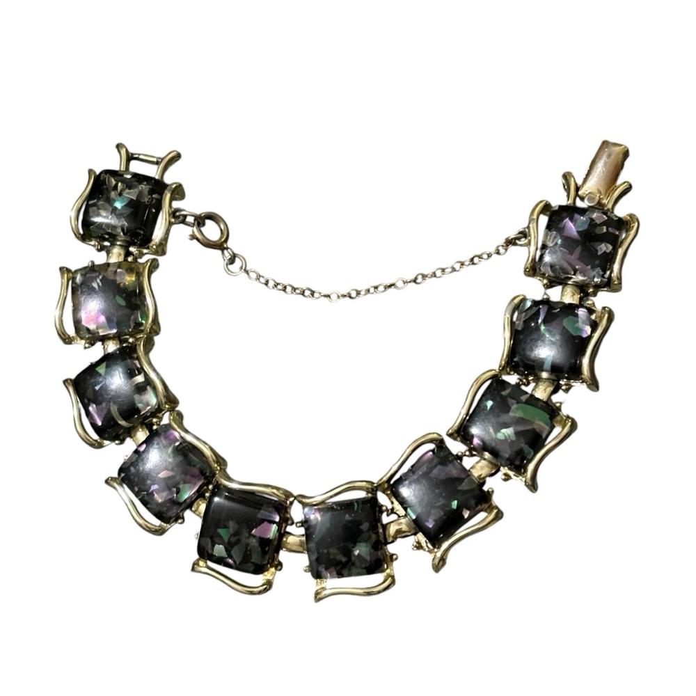 Vintage signed Pegasus CORO black metallic confetti lucite gold toned bracelet.
